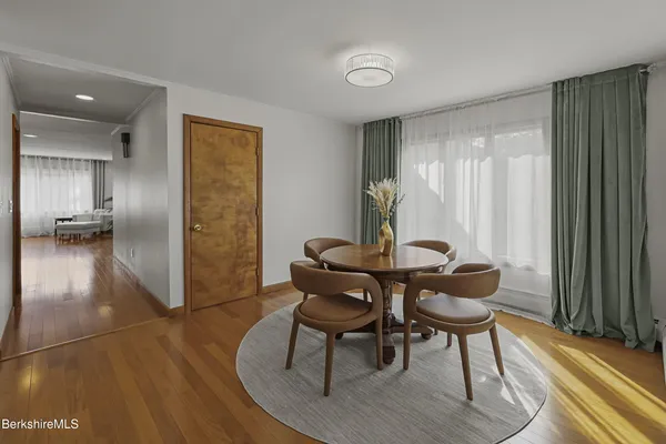 a kitchen with a stove a sink and a window