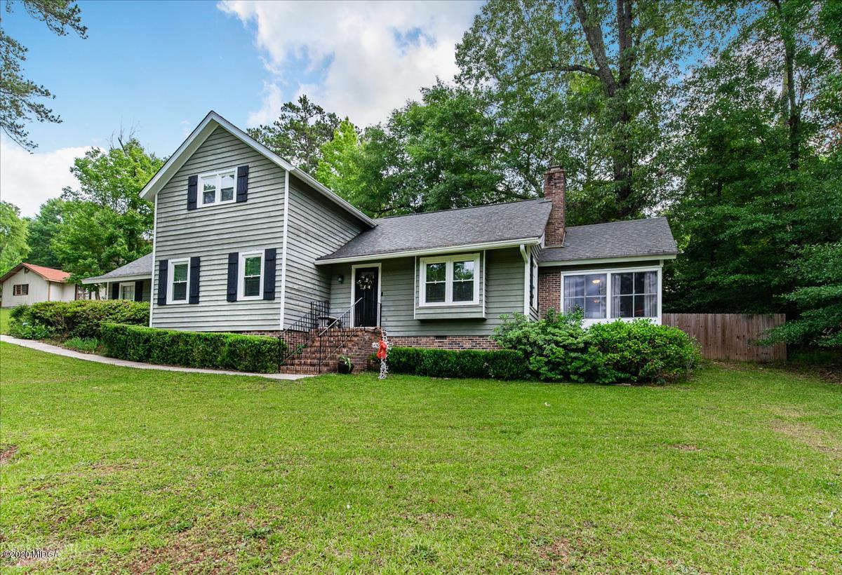 6431 Stapleton Road Macon, GA 31206 - Photo 1 of 29 a front view of a house with a garden and yard