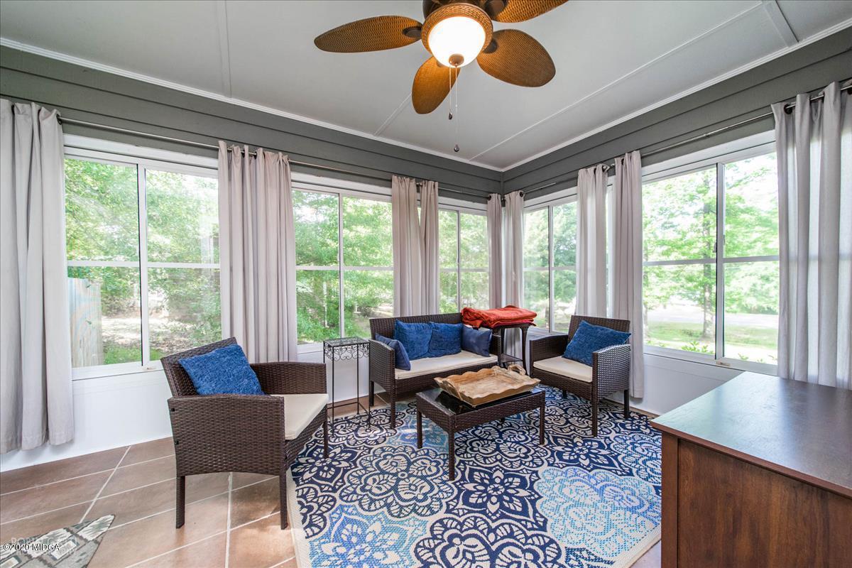 6431 Stapleton Road Macon, GA 31206 - Photo 13 of 29 a living room with furniture and a large window