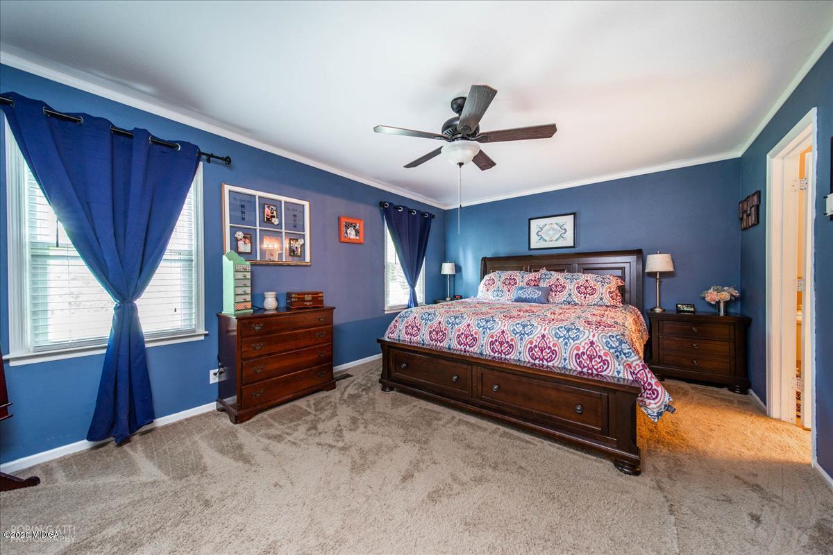 6431 Stapleton Road Macon, GA 31206 - Photo 15 of 29 a bedroom with a bed dresser and a window