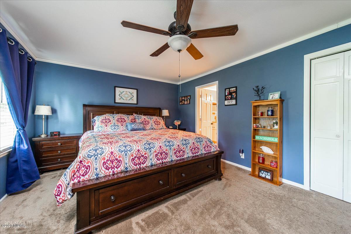 6431 Stapleton Road Macon, GA 31206 - Photo 16 of 29 a bedroom with a bed and a walk in closet