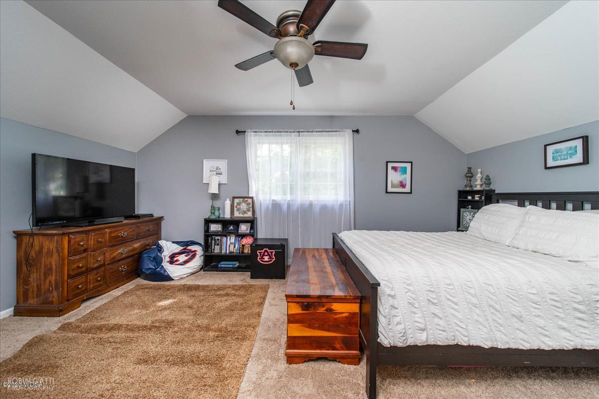 6431 Stapleton Road Macon, GA 31206 - Photo 19 of 29 a bedroom with furniture and a flat screen tv