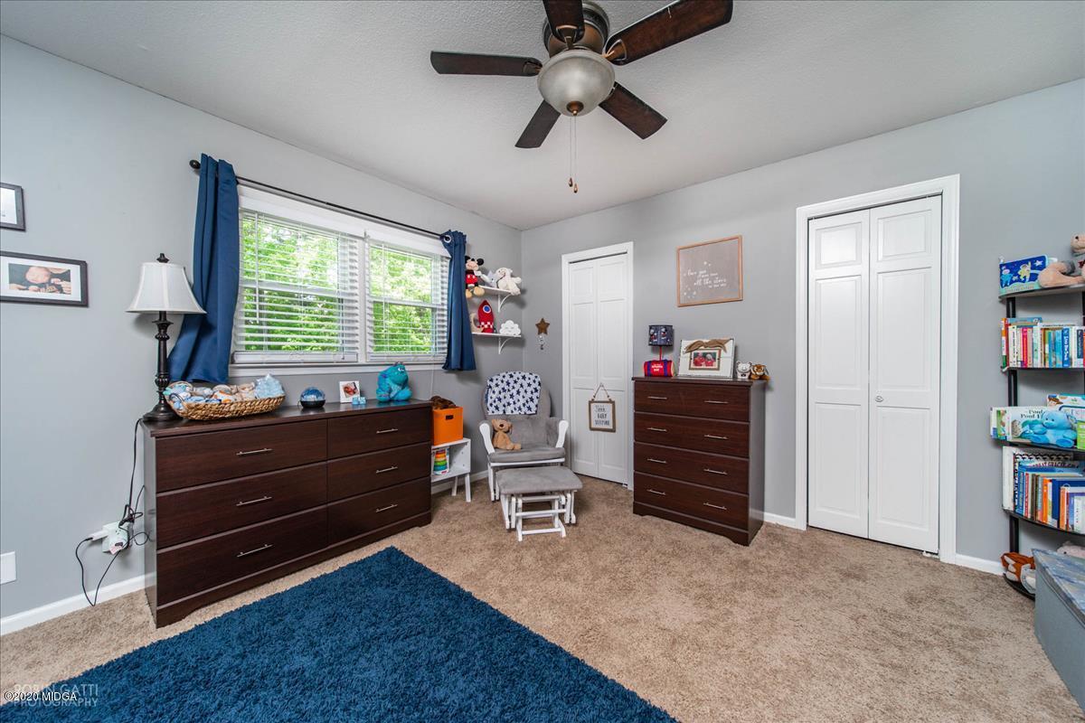 6431 Stapleton Road Macon, GA 31206 - Photo 22 of 29 a room with furniture and a window