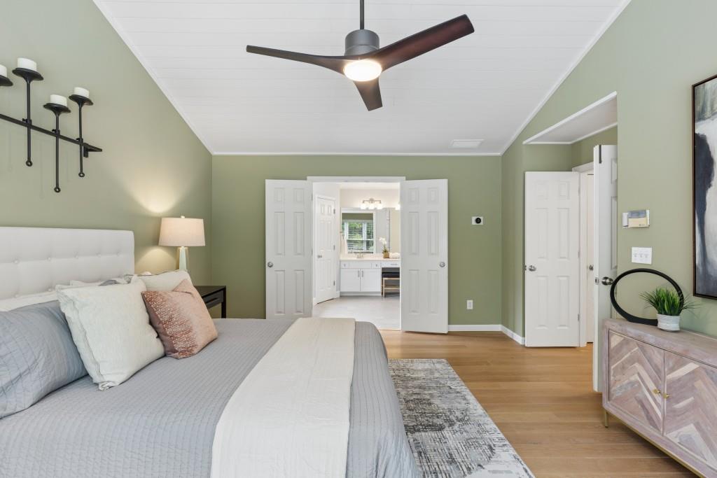 2120 Traywick Chase Alpharetta, GA 30004 - Photo 27 of 54 a bedroom with a large bed and a chandelier