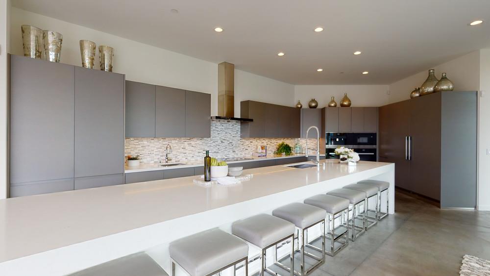 21 Gilmartin Drive Tiburon, CA 94920 - Photo 16 of 82 a large kitchen with kitchen island a large counter top space a sink stainless steel appliances and cabinets