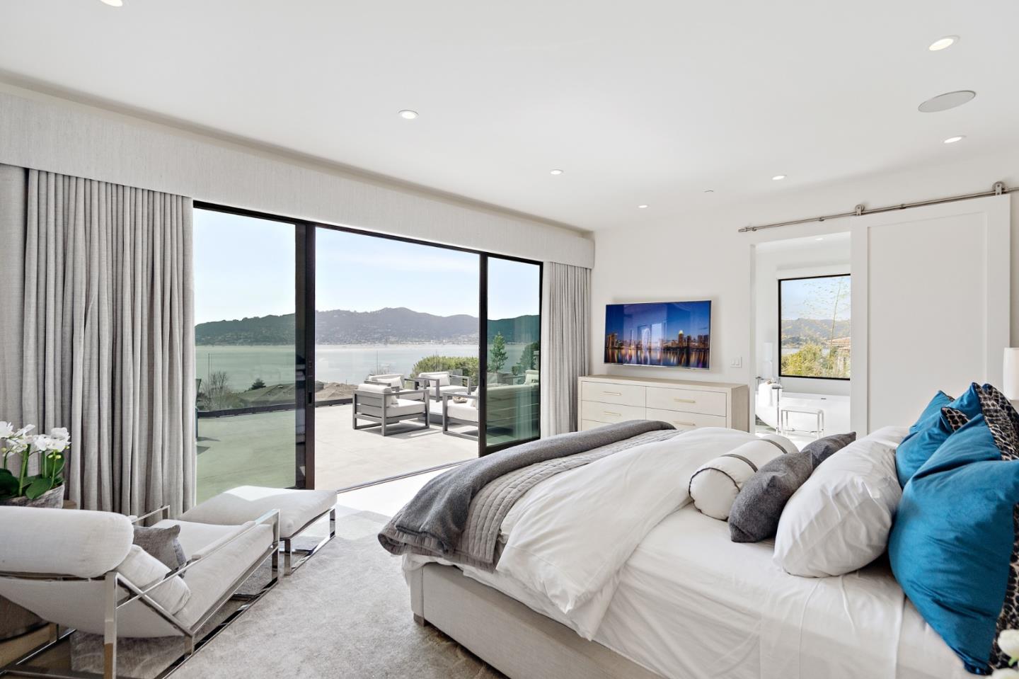 21 Gilmartin Drive Tiburon, CA 94920 - Photo 24 of 82 a bedroom with a large bed and a large window