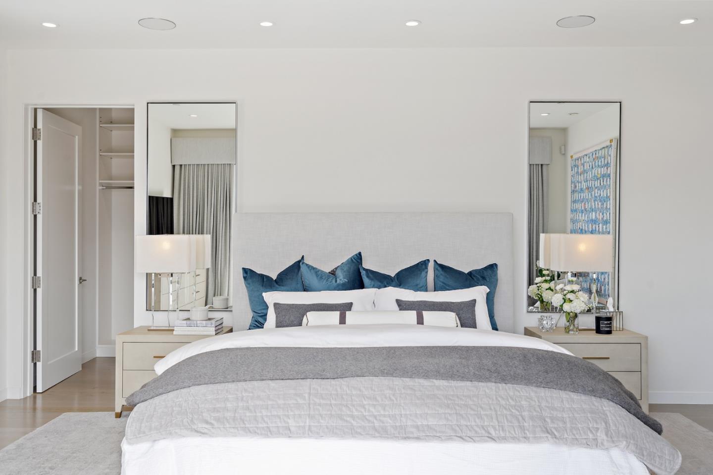 21 Gilmartin Drive Tiburon, CA 94920 - Photo 25 of 82 a bedroom with a bed and a potted plant