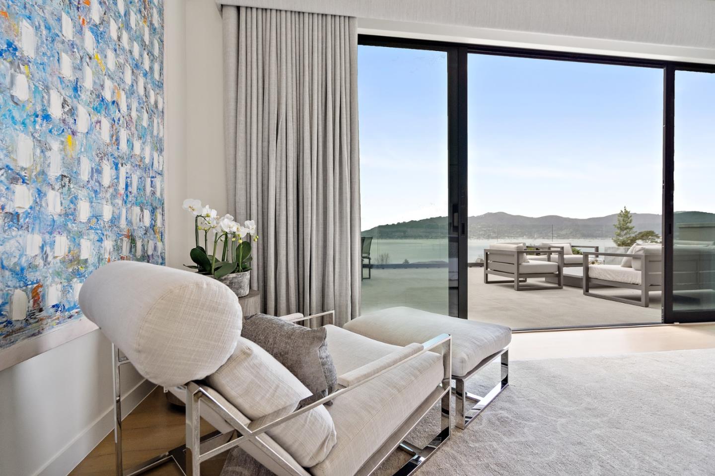 21 Gilmartin Drive Tiburon, CA 94920 - Photo 26 of 82 a living room with furniture and a floor to ceiling window