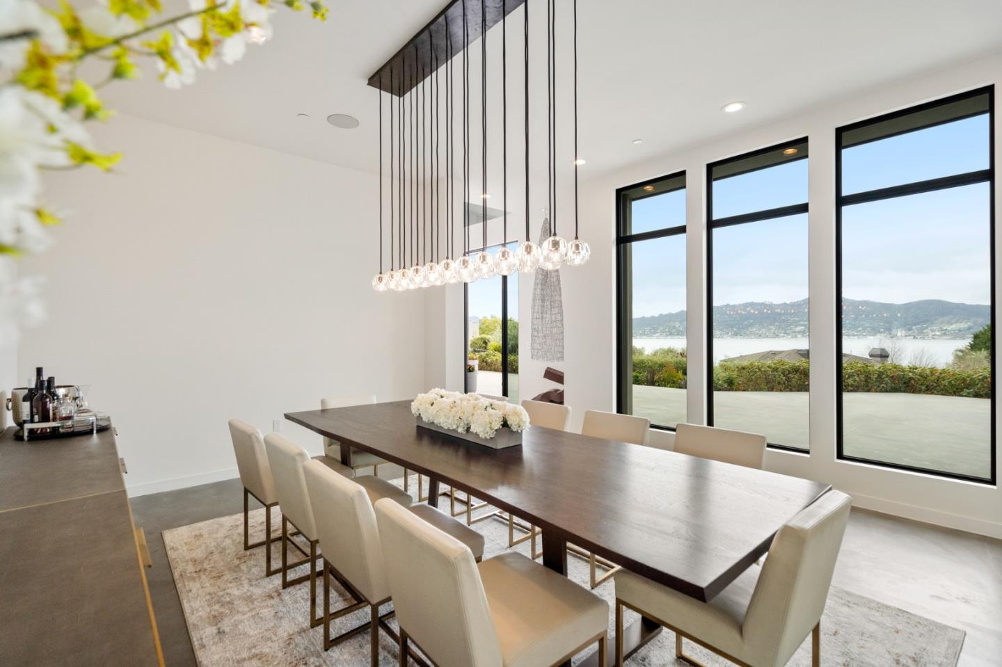 21 Gilmartin Drive Tiburon, CA 94920 - Photo 10 of 82 a dining room with furniture a chandelier and wooden floor