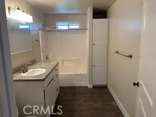 a bathroom with a sink and mirror