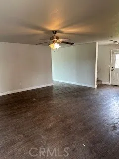 a view of a room with wooden floor