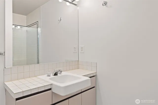 a bathroom with a sink and a mirror