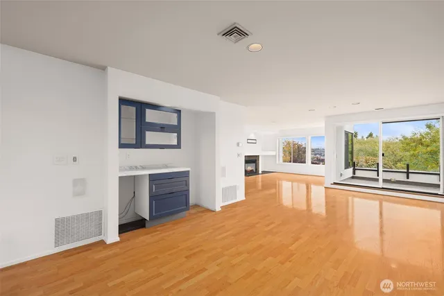 a spacious bedroom with a large bed and a flat screen tv