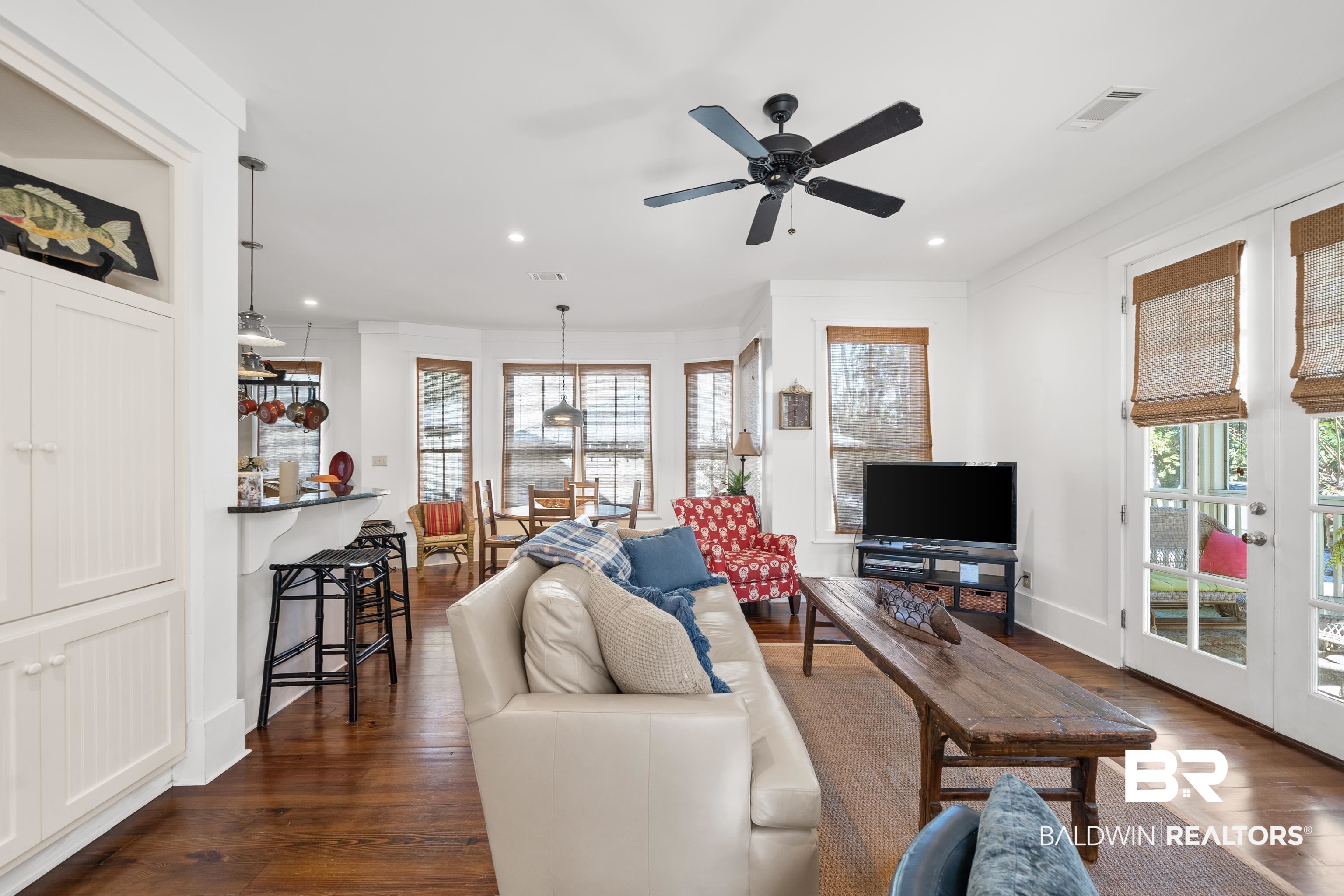 25773 Canal Road, Unit 10 Orange Beach, AL 36561 - Photo 10 of 40 Living room featuring beautiful hardwood floors