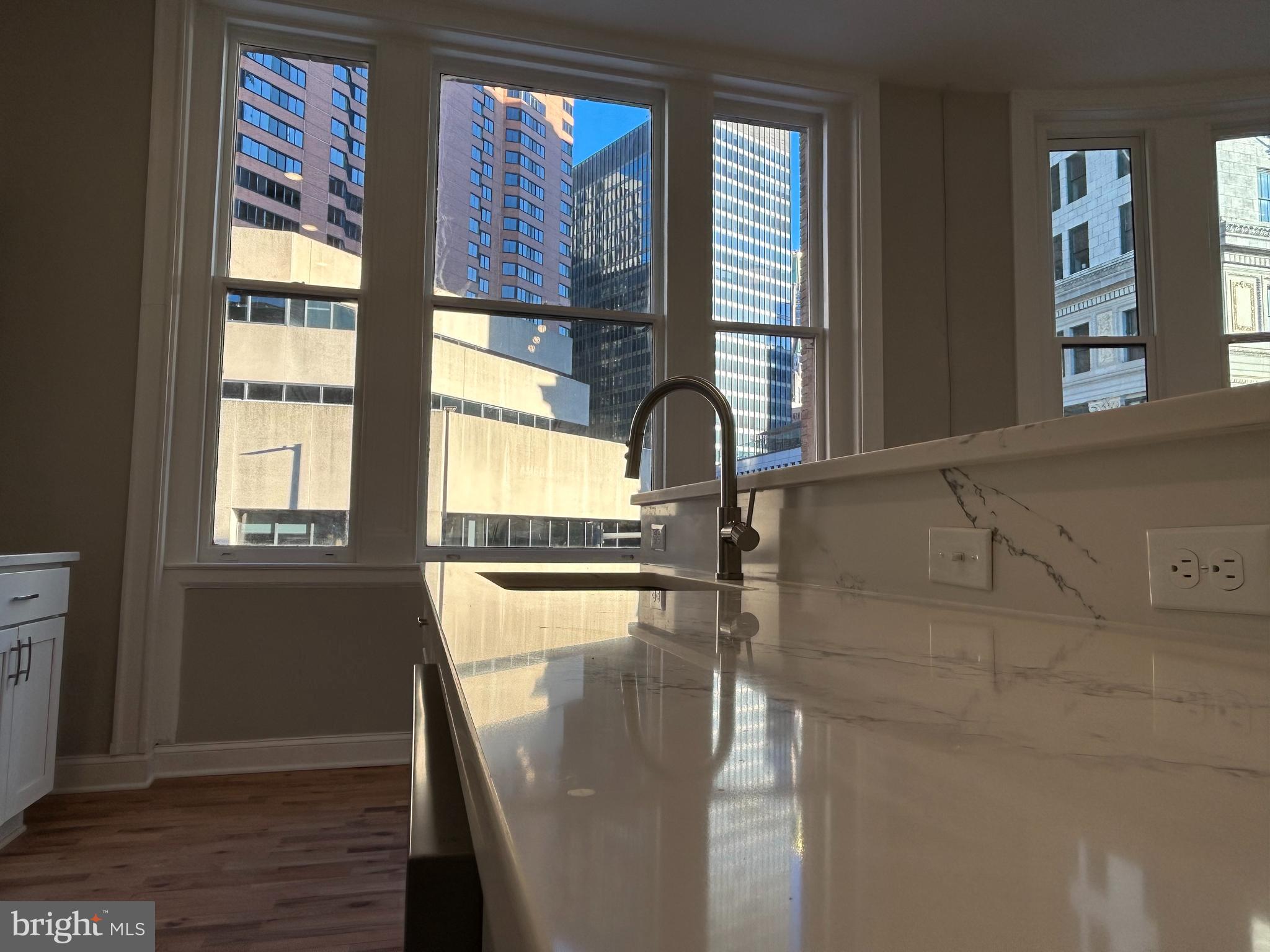 100 West Lexington Street, Unit 301 Baltimore, MD 21201 - Photo 9 of 30 a view of a living room with a large window