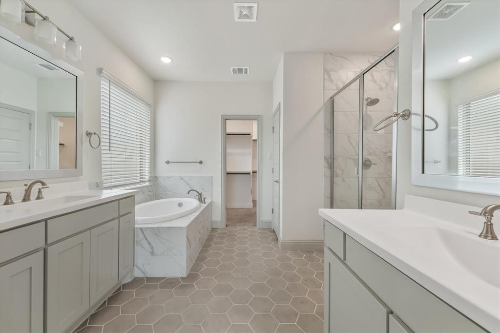3208 Heathrow Road Mesquite, TX 75181 - Photo 10 of 21 a spacious bathroom with a double vanity sink mirror double and bathtub