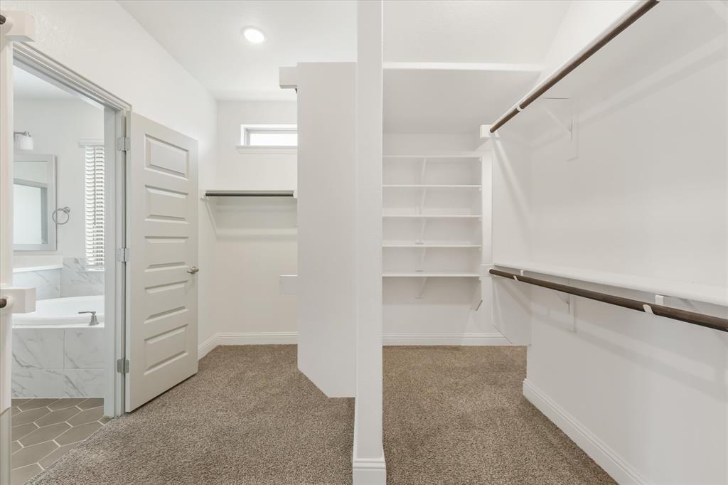 3208 Heathrow Road Mesquite, TX 75181 - Photo 12 of 21 a view of walk in closet with empty racks