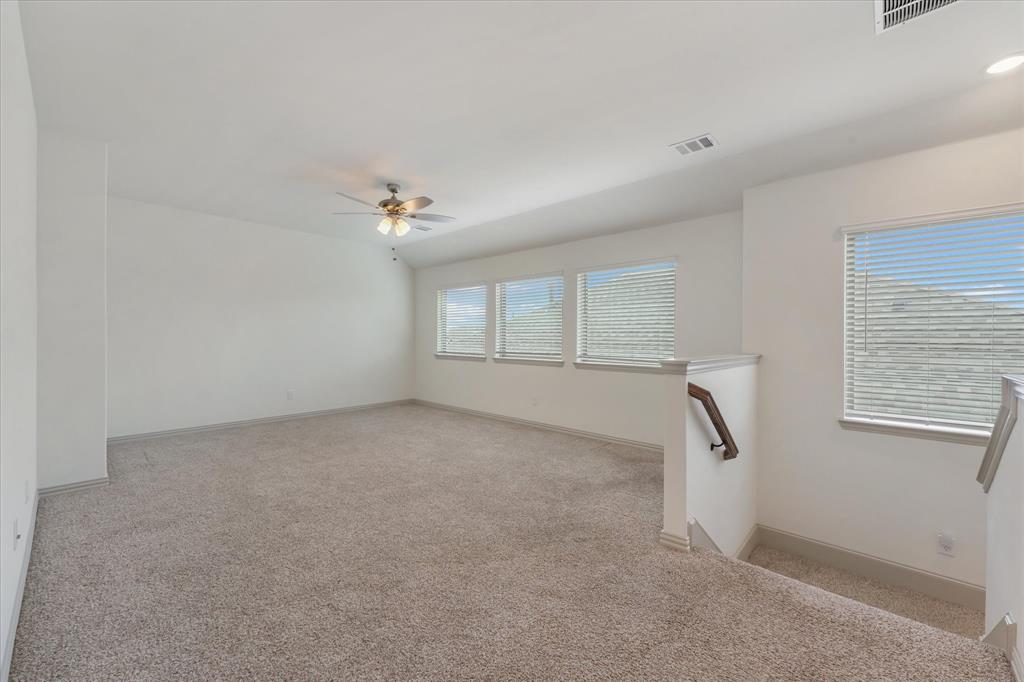 3208 Heathrow Road Mesquite, TX 75181 - Photo 13 of 21 a view of a livingroom with a ceiling fan and window