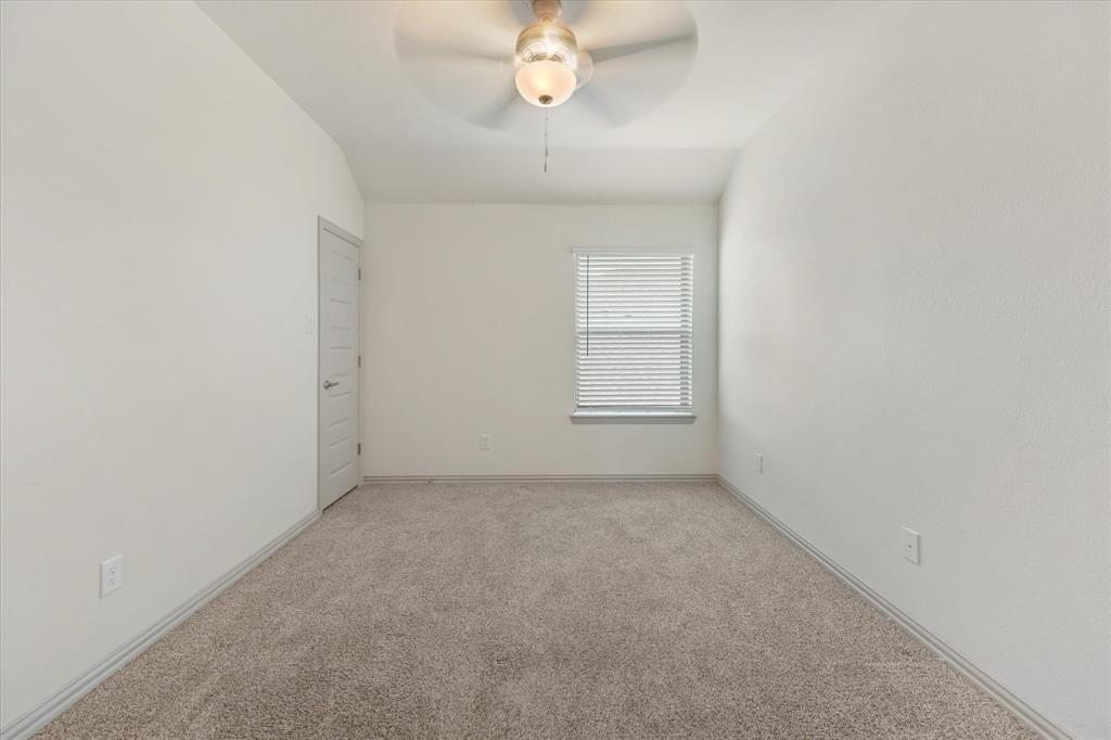 3208 Heathrow Road Mesquite, TX 75181 - Photo 15 of 21 an empty room with windows and fan