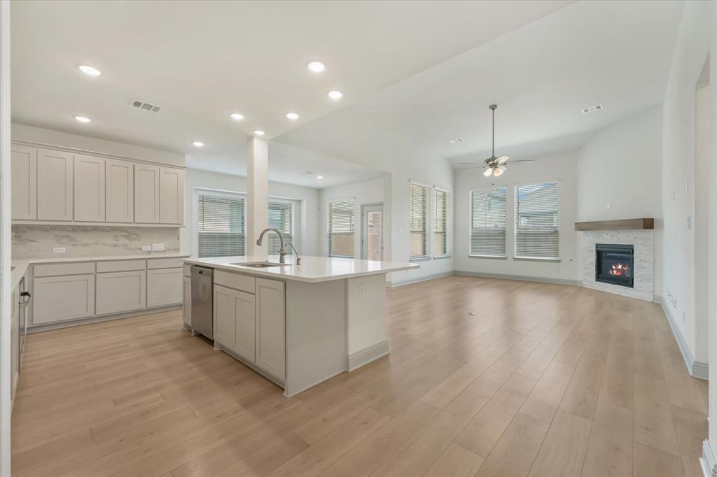 3208 Heathrow Road Mesquite, TX 75181 - Photo 20 of 21 a large kitchen with kitchen island a sink stainless steel appliances and cabinets