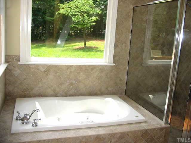 2008 Hilly Ridge Raleigh, NC 27603 - Photo 8 of 10 a bathroom with a bathtub and shower