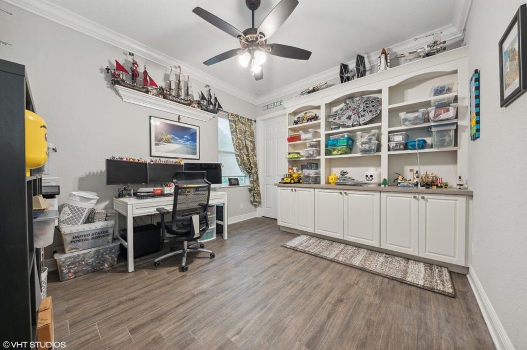7619 Southeast Belle Maison Drive Stuart, FL 34997 - Photo 16 of 44 a view of a workspace with furniture and a kitchen
