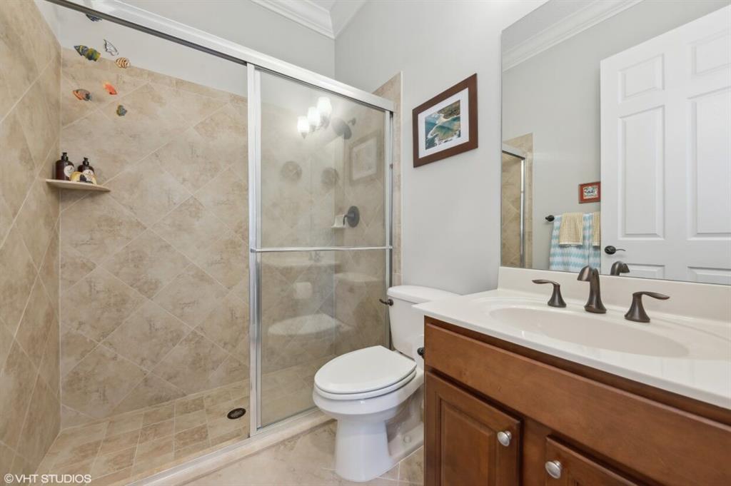 7619 Southeast Belle Maison Drive Stuart, FL 34997 - Photo 19 of 44 a bathroom with a sink a toilet and shower