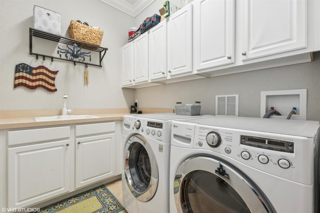 7619 Southeast Belle Maison Drive Stuart, FL 34997 - Photo 21 of 44 a utility room with dryer and washer