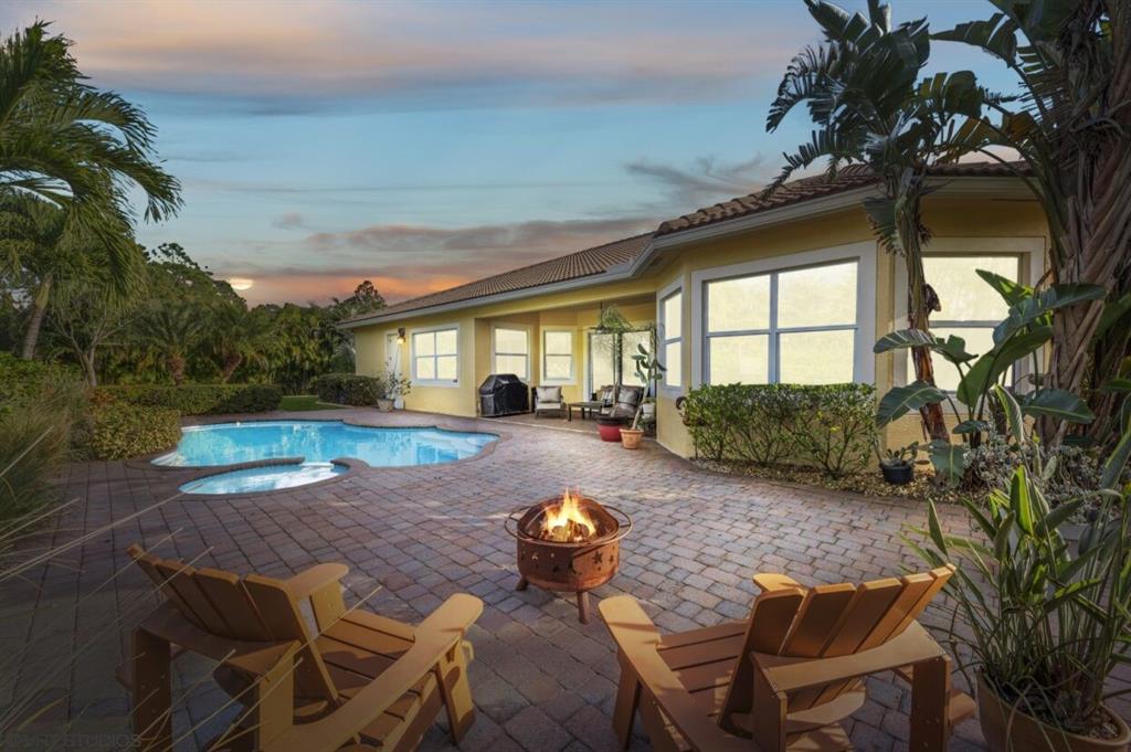 7619 Southeast Belle Maison Drive Stuart, FL 34997 - Photo 22 of 44 a view of backyard with seating space