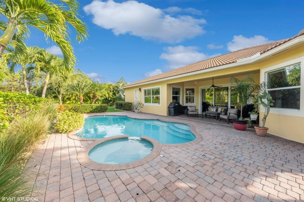 7619 Southeast Belle Maison Drive Stuart, FL 34997 - Photo 25 of 44 a view of a house with a swimming pool and sitting area