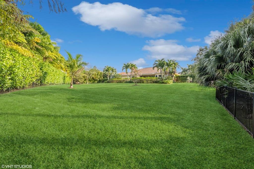 7619 Southeast Belle Maison Drive Stuart, FL 34997 - Photo 27 of 44 a view of a golf course with a big yard
