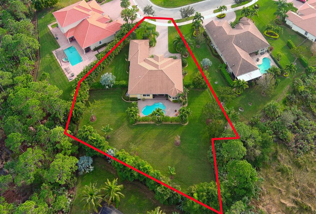 7619 Southeast Belle Maison Drive Stuart, FL 34997 - Photo 35 of 44 an aerial view of residential house with outdoor space and swimming pool