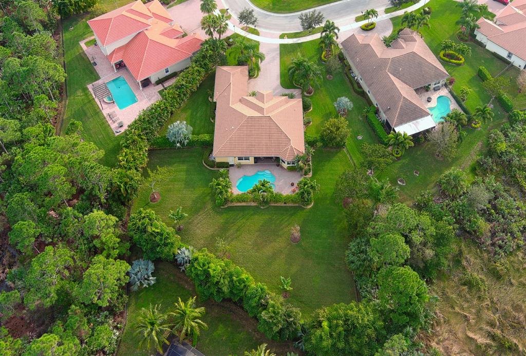 7619 Southeast Belle Maison Drive Stuart, FL 34997 - Photo 36 of 44 an aerial view of residential house with outdoor space and swimming pool