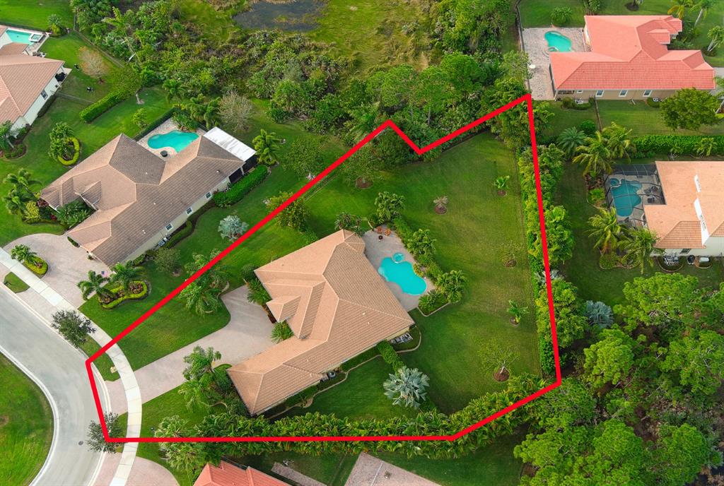 7619 Southeast Belle Maison Drive Stuart, FL 34997 - Photo 37 of 44 an aerial view of a house