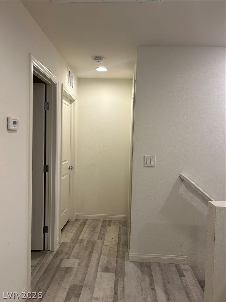 10638 Adobe Rnch Street Las Vegas, NV 89141 - Photo 26 of 35 Hall with wood-style floors and baseboards