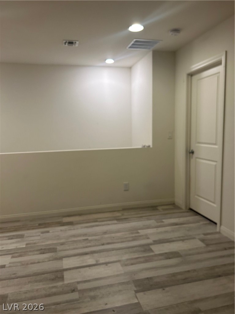 10638 Adobe Rnch Street Las Vegas, NV 89141 - Photo 28 of 35 Unfurnished room with wood-style finished floors and recessed lighting