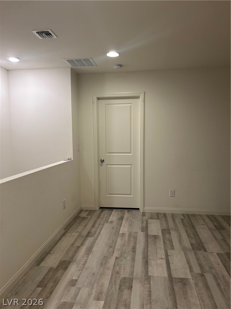 10638 Adobe Rnch Street Las Vegas, NV 89141 - Photo 29 of 35 Unfurnished room with wood-style finished floors and recessed lighting