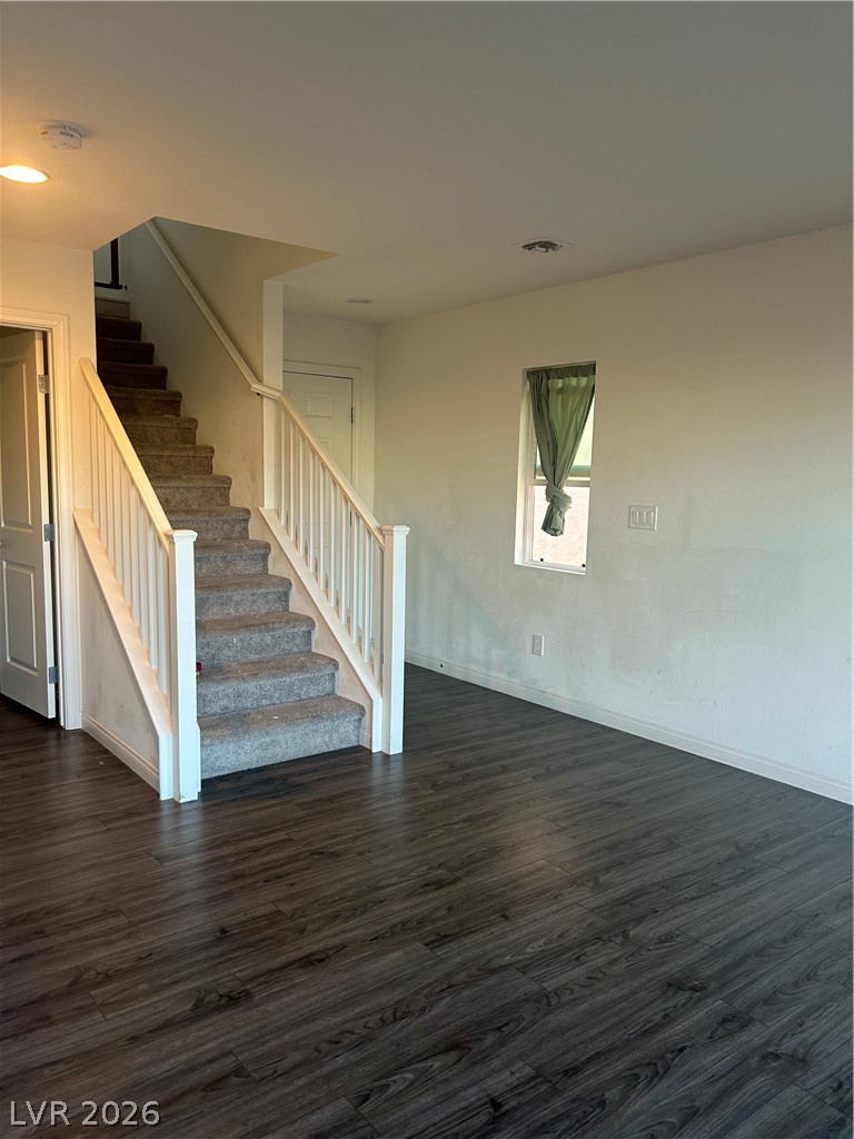 10638 Adobe Rnch Street Las Vegas, NV 89141 - Photo 9 of 35 Unfurnished living room with dark wood finished floors