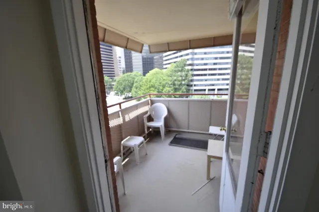 a workspace with furniture and a window