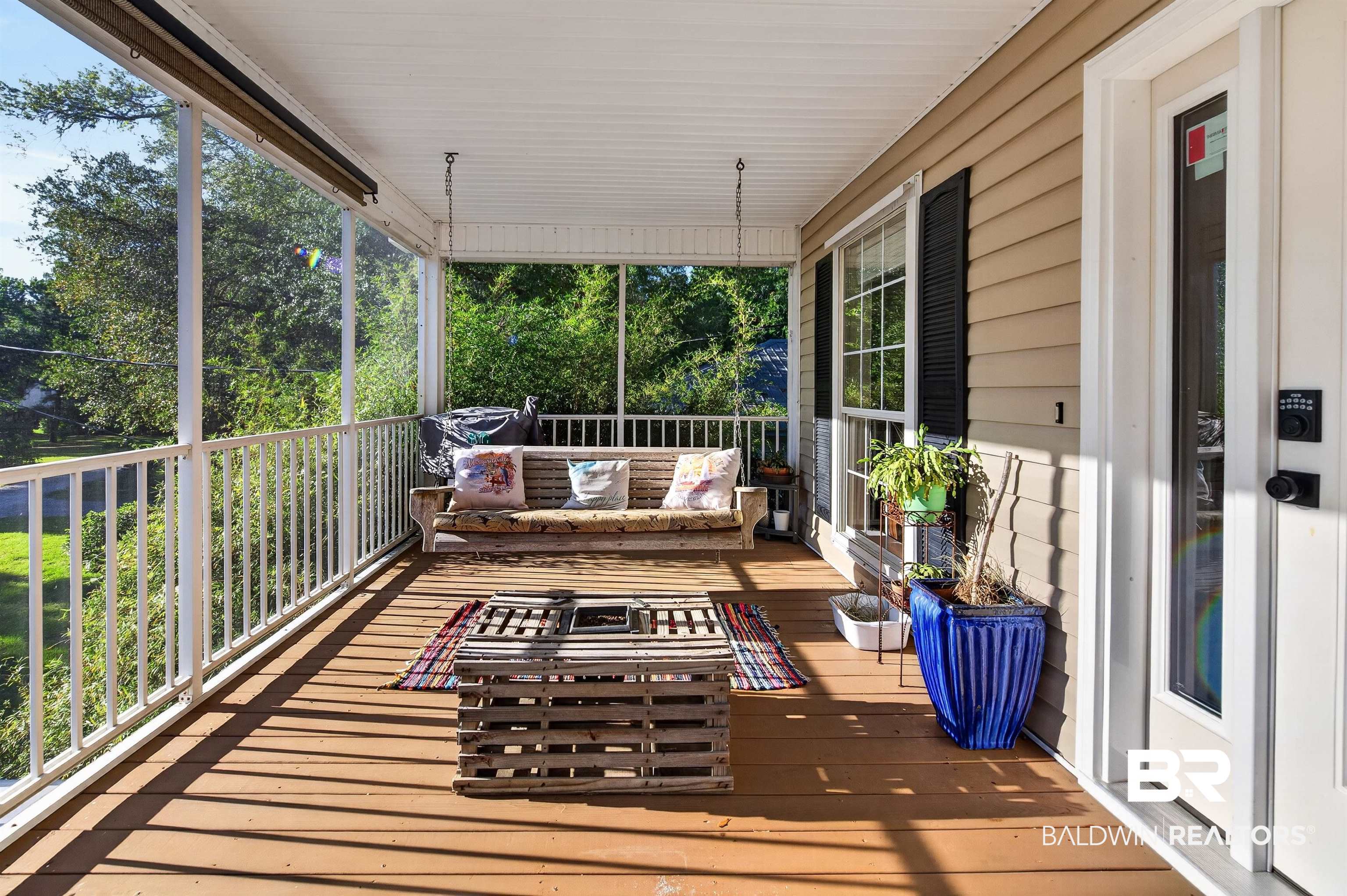 9624 North Bay Street Foley, AL 36535 - Photo 36 of 59 Screened porch featuring wood-finish flooring, white railing, and a beadboard ceiling