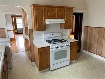 a kitchen with granite countertop cabinets and steel stainless steel appliances