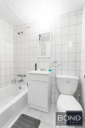 a bathroom with a toilet a sink and bathtub
