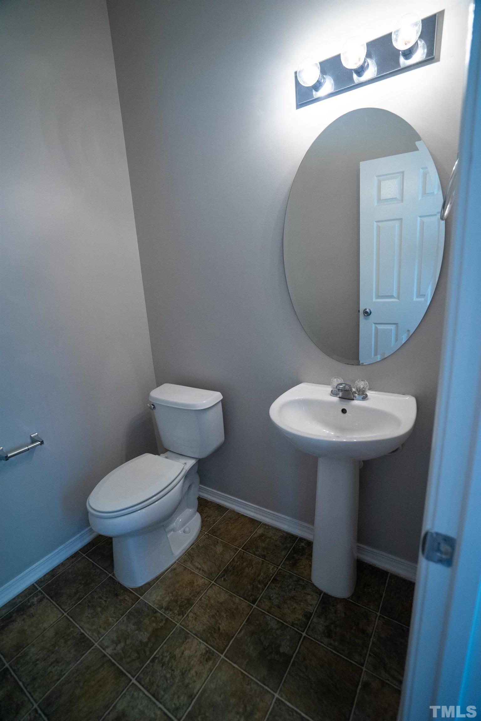 3 Mint Hill Court Durham, NC 27703 - Photo 6 of 19 a bathroom with a sink toilet and a mirror