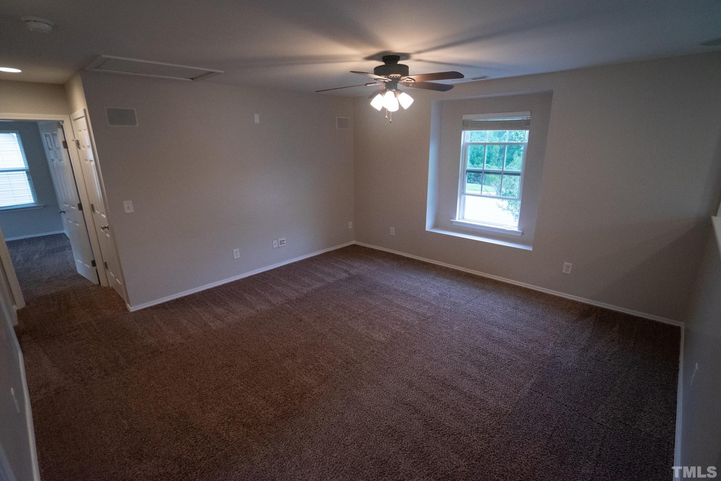3 Mint Hill Court Durham, NC 27703 - Photo 10 of 19 an empty room with windows and fan