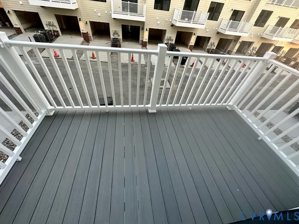 a view of a balcony with wooden floor