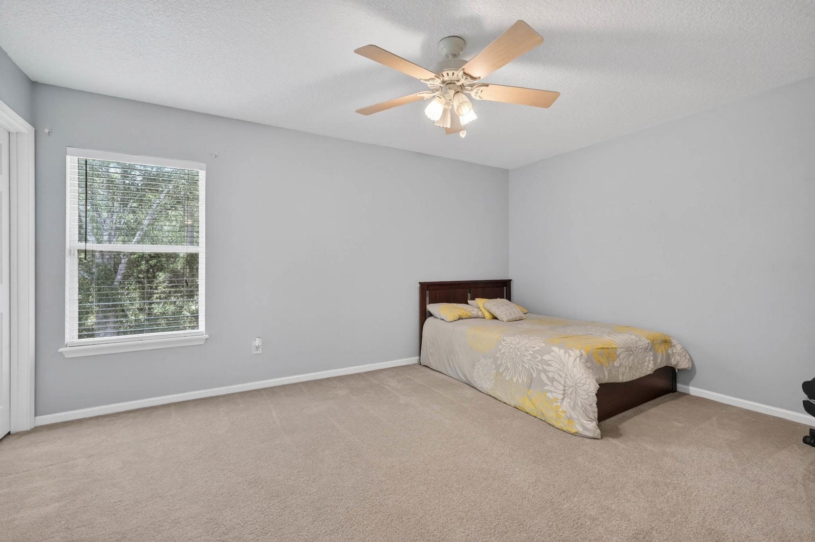 1237 Splendid Ravine Street St. Augustine, FL 32092 - Photo 29 of 62 a room with a bed and a chandelier