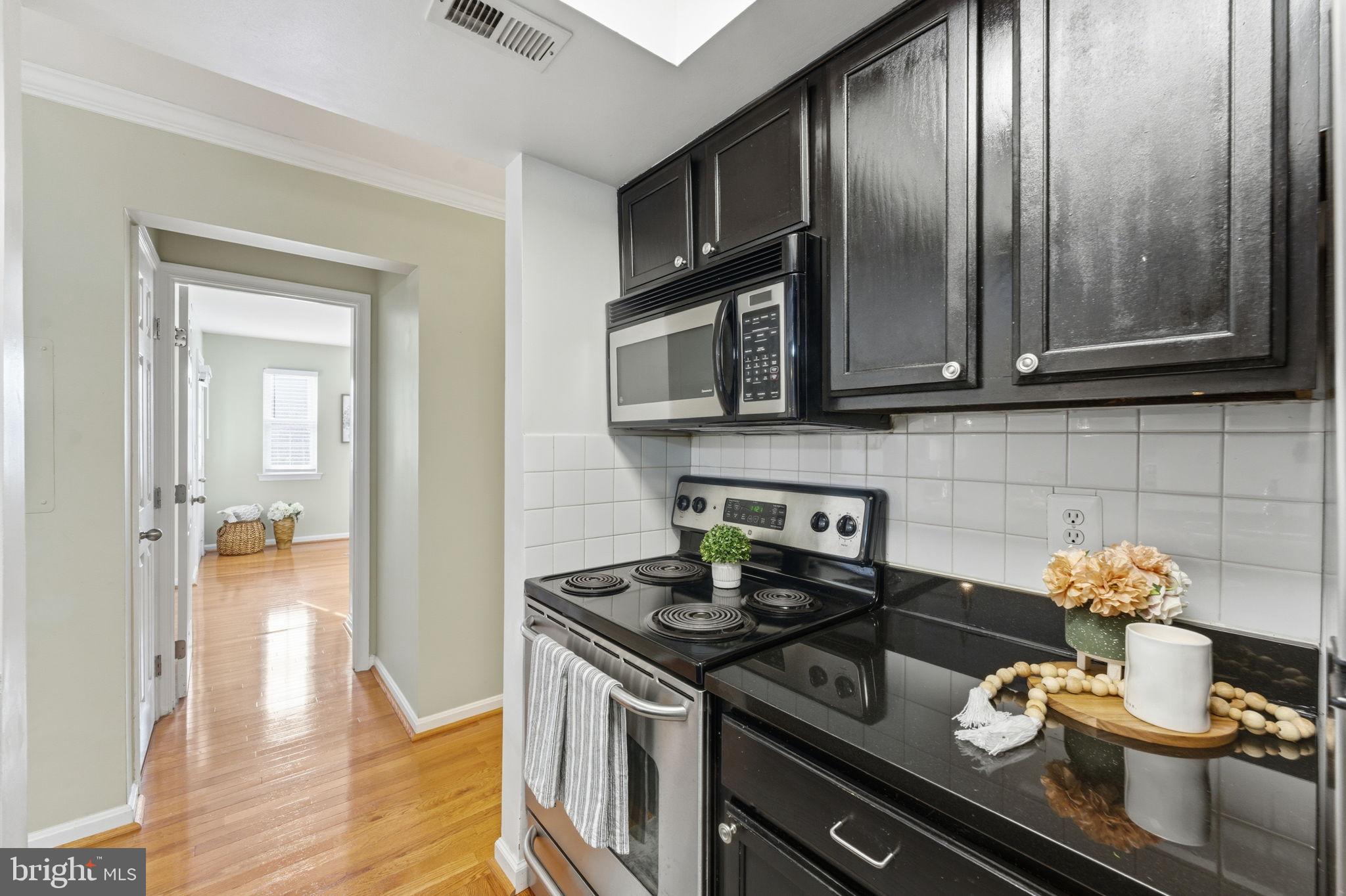 14901 Rydell Road, Unit 303 Centreville, VA 20121 - Photo 19 of 45 Sleek kitchen with modern finishes.