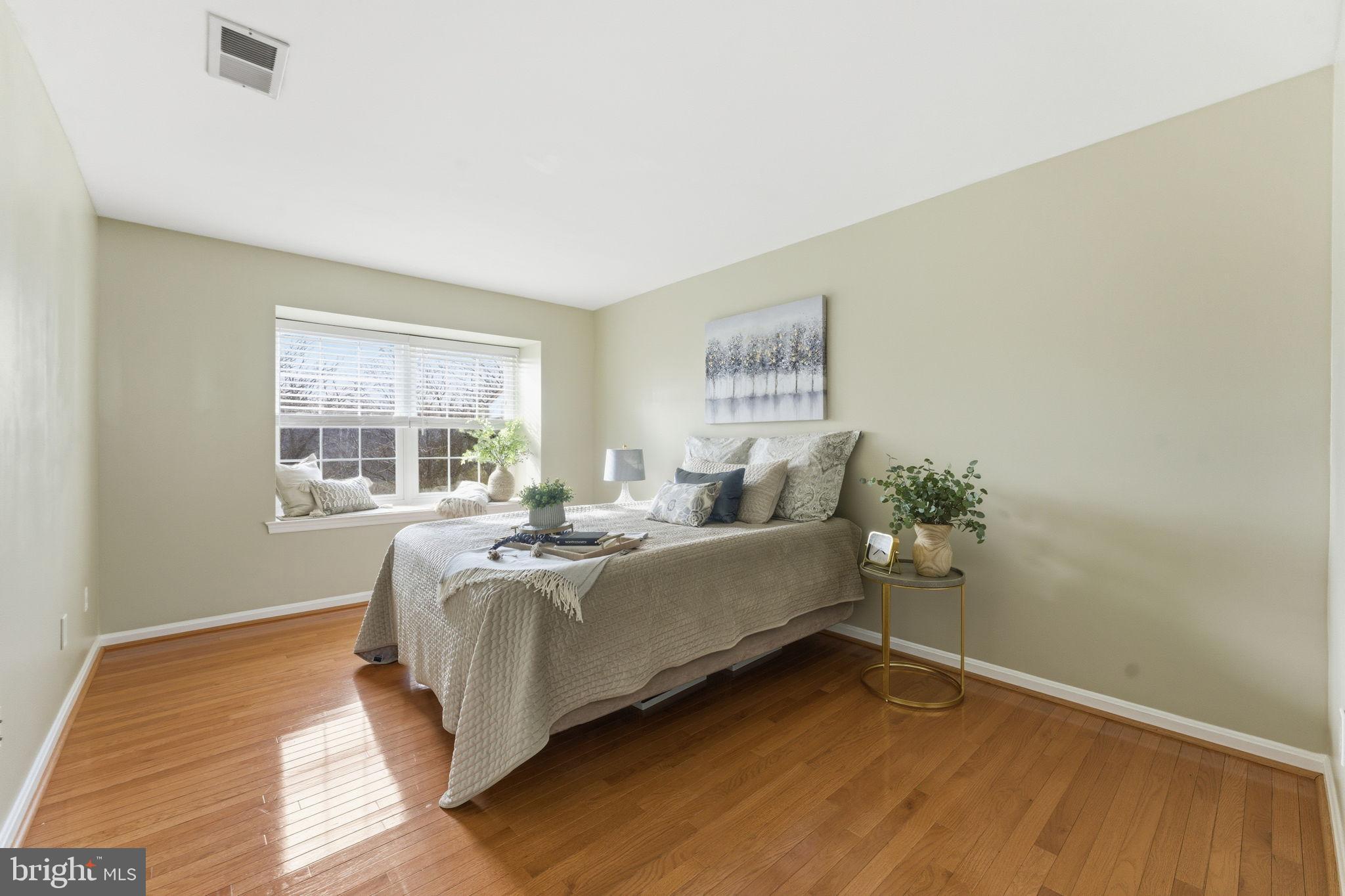 14901 Rydell Road, Unit 303 Centreville, VA 20121 - Photo 20 of 45 Serene bedroom with natural light and warmth.