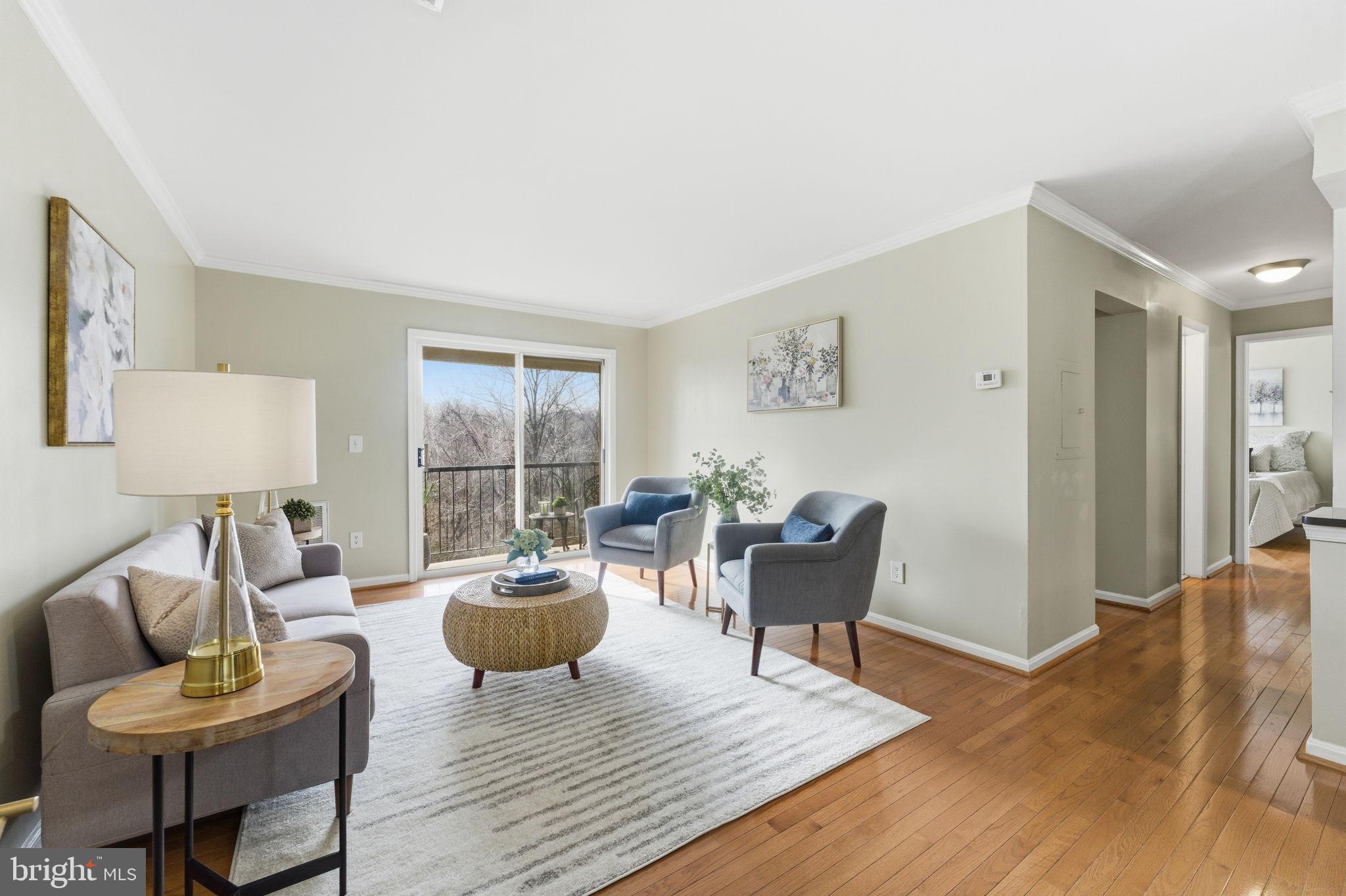 14901 Rydell Road, Unit 303 Centreville, VA 20121 - Photo 8 of 45 Bright and airy living space with scenic views.