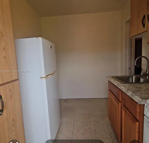a utility room with washer and dryer